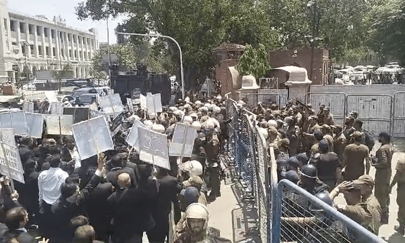 Lawyers protest amid heavy police deployment and barricades.